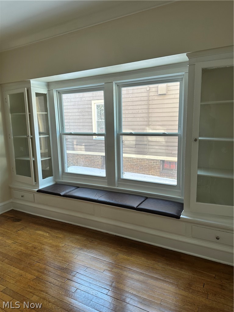 1635 Belmar Road, Unit 1 Cleveland, OH 44118 - Photo 5 of 12 dining room with curio and bench