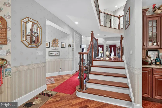 a living room with furniture and a gym