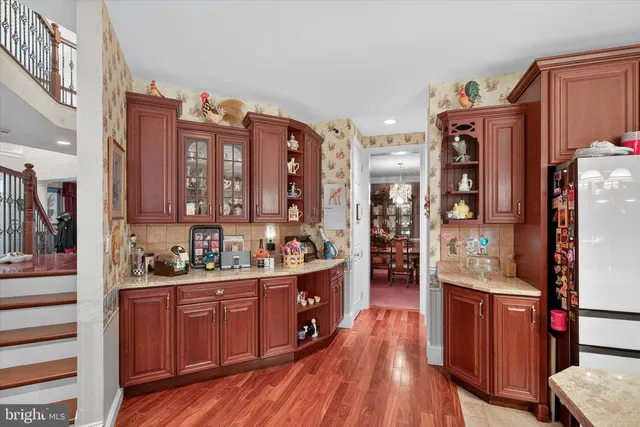 a living room with fireplace furniture and a large window