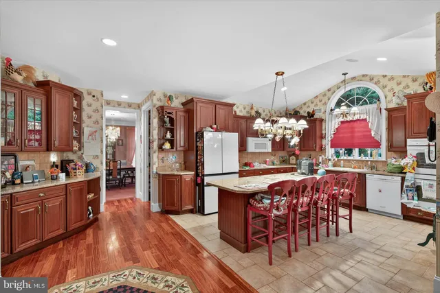 a living room with lots of furniture and air hockey table