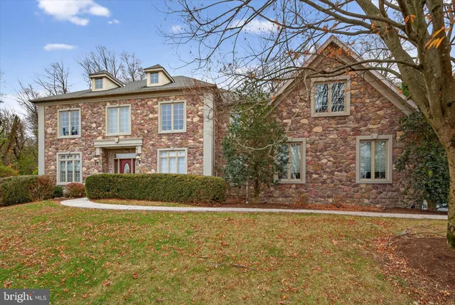a living room with lots of furniture and kitchen view