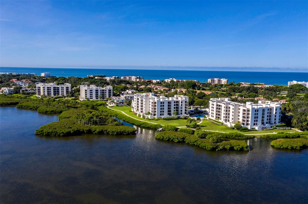 2016 Harbourside Drive, Unit 317 Longboat Key, FL 34228 - Photo 1 of 1 a view of a lake with a house in the background