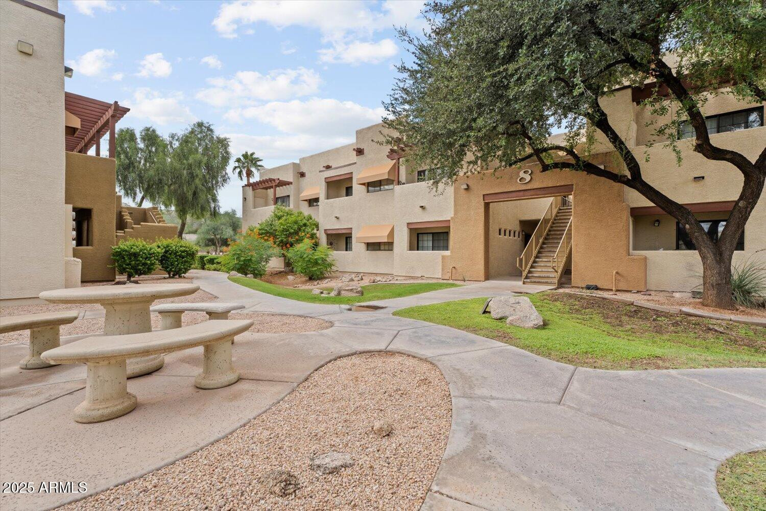 3434 East Baseline Road, Unit 260 Phoenix, AZ 85042 - Photo 2 of 15 a front view of a house with garden