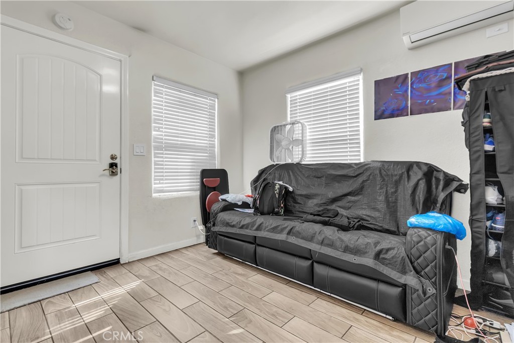 141 West 83rd Street Los Angeles, CA 90003 - Photo 12 of 22 a living room with furniture and a window