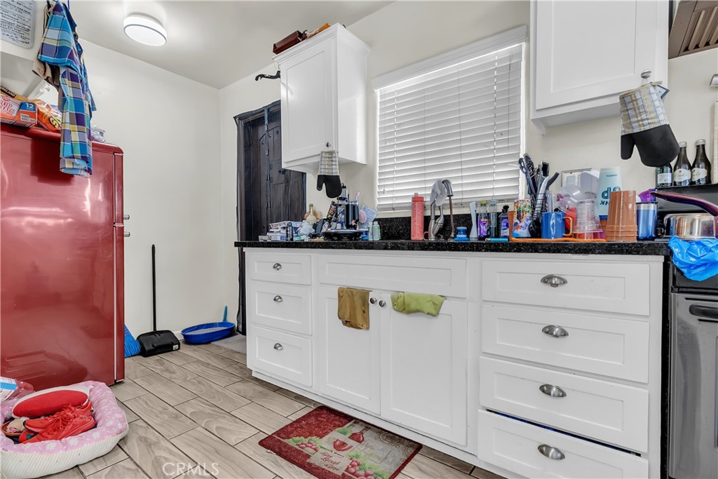 141 West 83rd Street Los Angeles, CA 90003 - Photo 18 of 22 a view of kitchen and cabinets