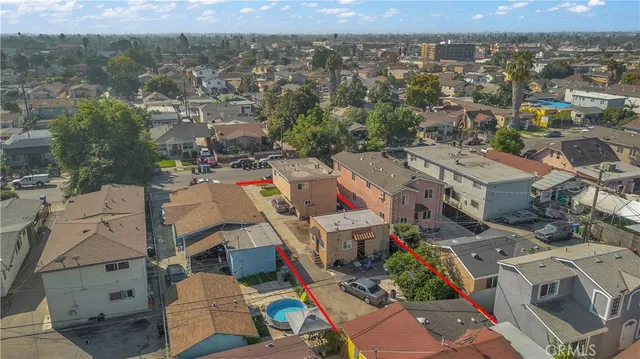 an aerial view of multiple houses with outdoor space