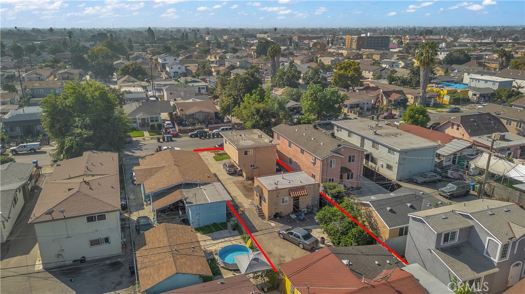 141 West 83rd Street Los Angeles, CA 90003 - Photo 19 of 22 an aerial view of a city with lots of residential buildings