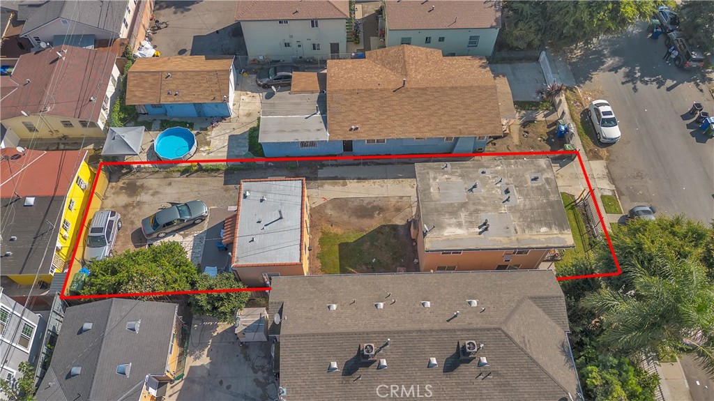141 West 83rd Street Los Angeles, CA 90003 - Photo 20 of 22 an aerial view of multiple houses with outdoor space
