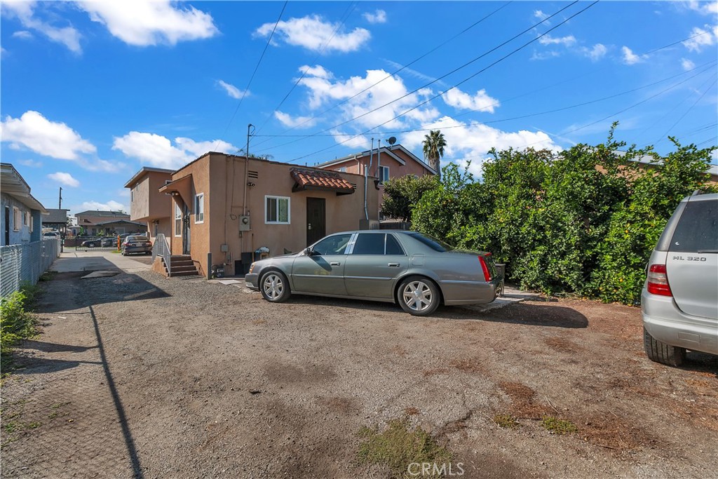 141 West 83rd Street Los Angeles, CA 90003 - Photo 8 of 22 a view of a car parked in front of a house