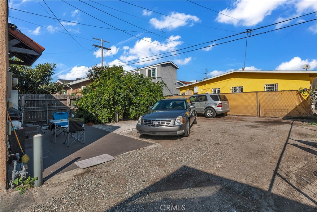 141 West 83rd Street Los Angeles, CA 90003 - Photo 9 of 22 a car parked in front of house