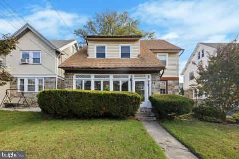 7011 Hazel Avenue Upper Darby, PA 19082 - Photo 1 of 16 a front view of a house with a garden