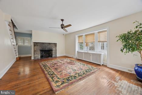 7011 Hazel Avenue Upper Darby, PA 19082 - Photo 3 of 16 a living room with a rug and a fireplace