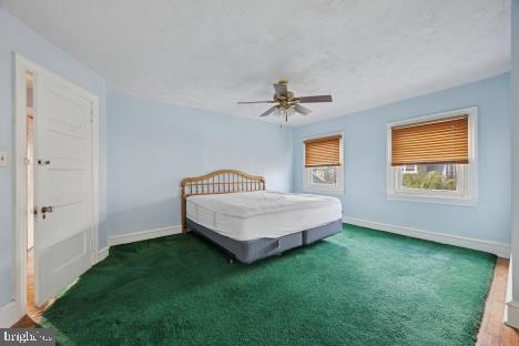 7011 Hazel Avenue Upper Darby, PA 19082 - Photo 8 of 16 a bedroom with a bed and a window