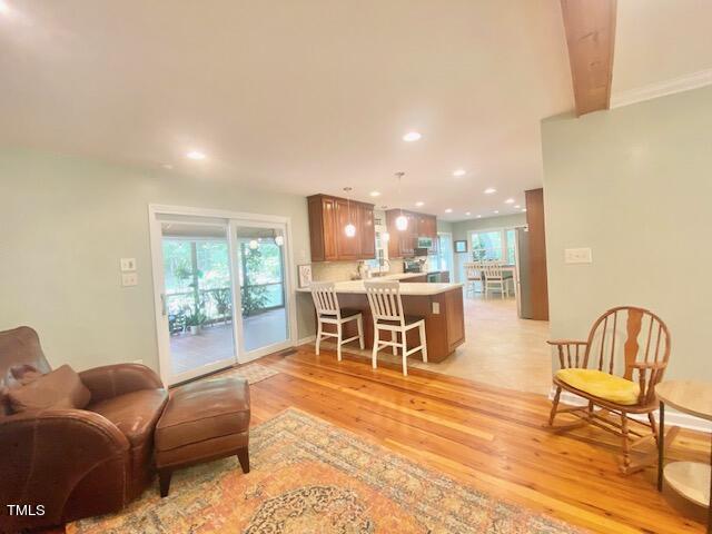 4400 Currie Court Raleigh, NC 27613 - Photo 12 of 35 a living room with furniture and a table