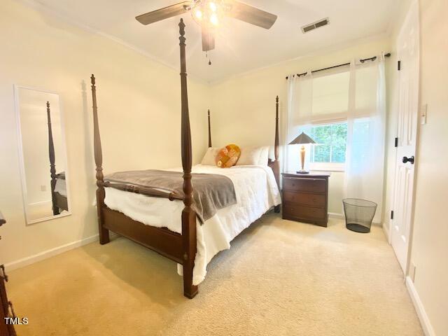 4400 Currie Court Raleigh, NC 27613 - Photo 26 of 35 a spacious bedroom with a large window and a chandelier