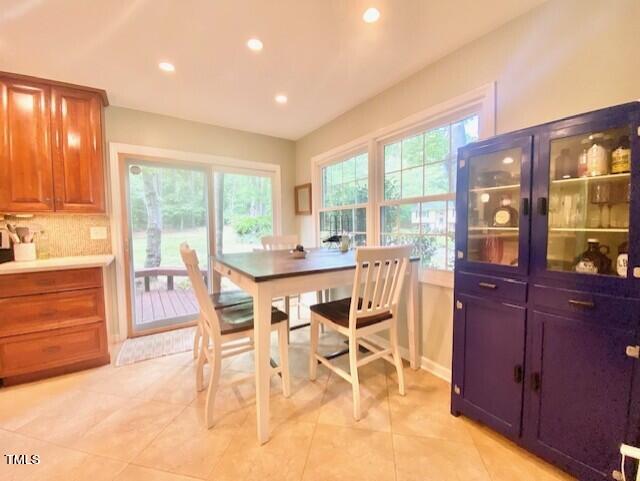 4400 Currie Court Raleigh, NC 27613 - Photo 10 of 35 a dining room with furniture and large windows