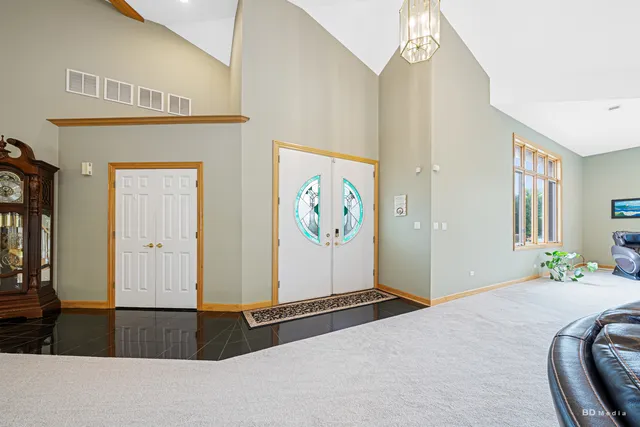 a kitchen with stainless steel appliances granite countertop a stove a sink a oven and a refrigerator