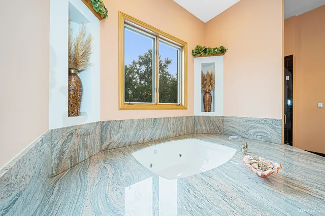 a view of a bathroom with a glass door and shower