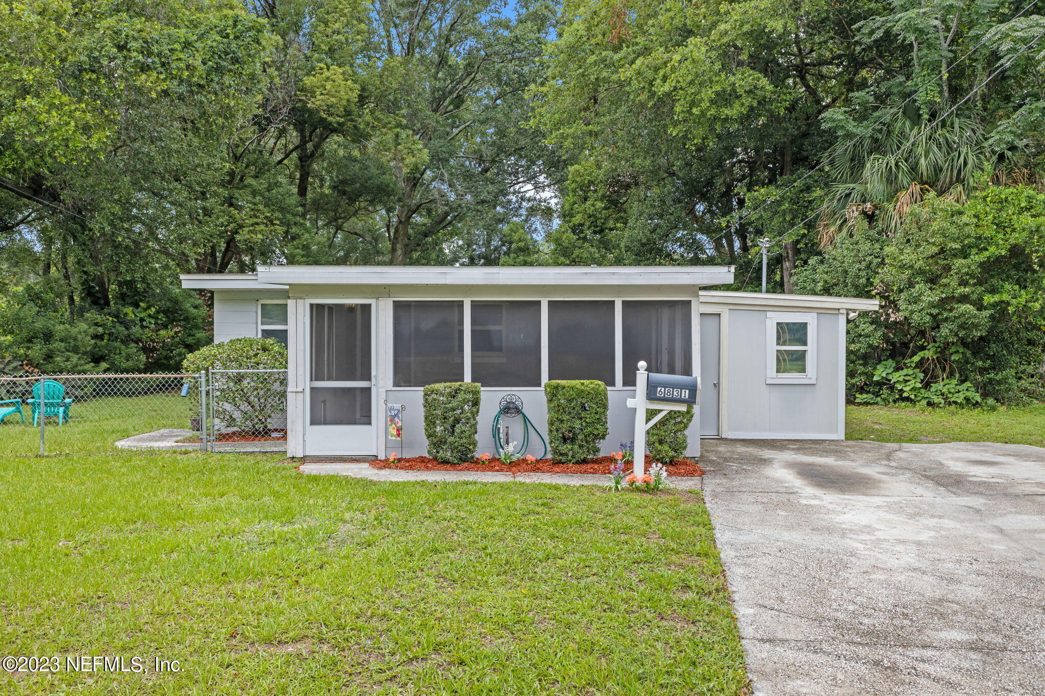 6831 Morgana Road North Jacksonville, FL 32211 - Photo 1 of 25 a house with garden in front of it