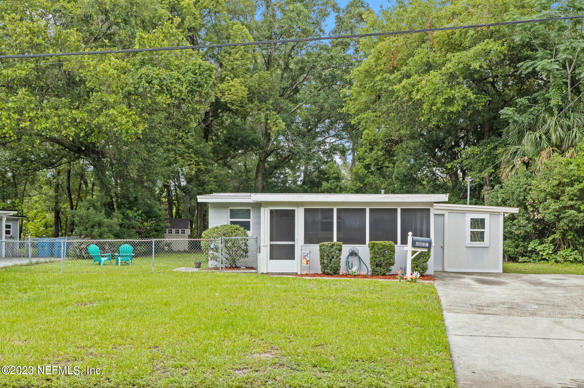 6831 Morgana Road North Jacksonville, FL 32211 - Photo 3 of 25 a view of a house with backyard and a garden
