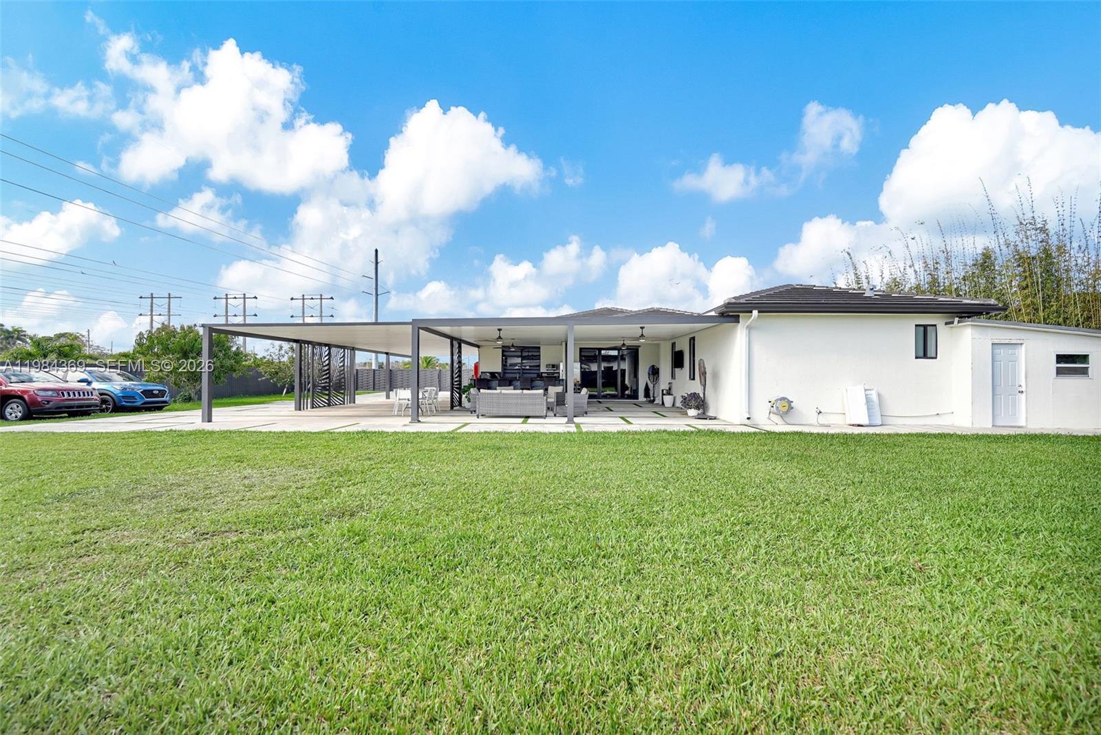 13334 Southwest 227th Street Miami, FL 33170 - Photo 21 of 69 a view of a house with backyard