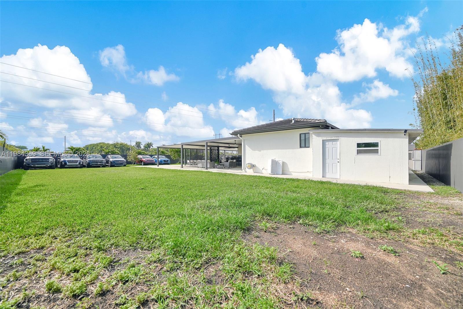 13334 Southwest 227th Street Miami, FL 33170 - Photo 22 of 69 a view of a house with a backyard