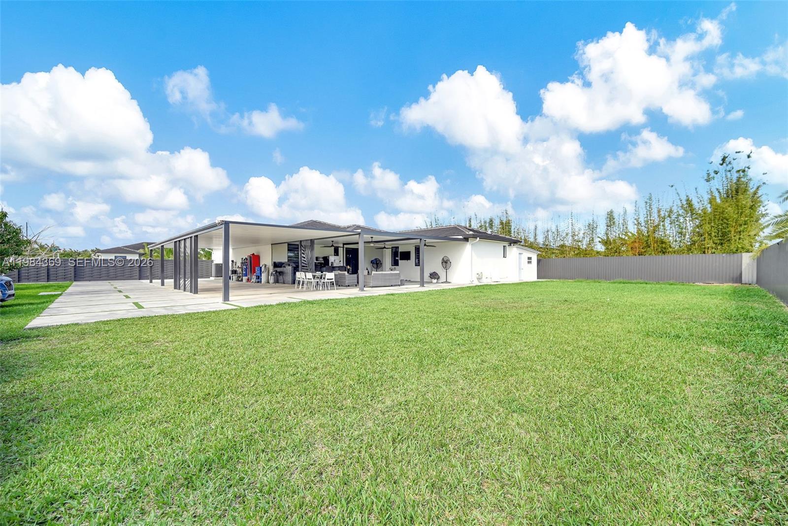 13334 Southwest 227th Street Miami, FL 33170 - Photo 23 of 69 a view of building with garden space and entertaining space
