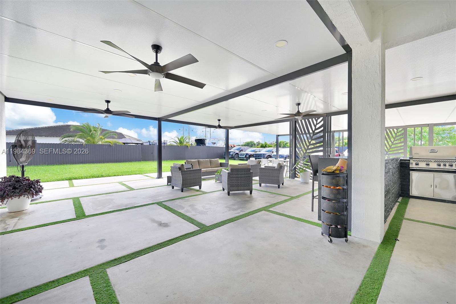 13334 Southwest 227th Street Miami, FL 33170 - Photo 28 of 69 a living room with lots of furniture and a clock
