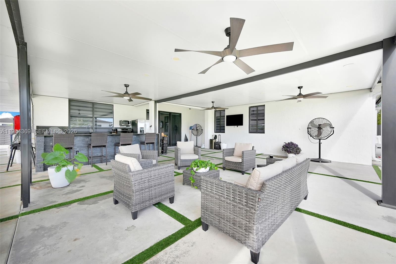 13334 Southwest 227th Street Miami, FL 33170 - Photo 30 of 69 a living room with furniture and a large window