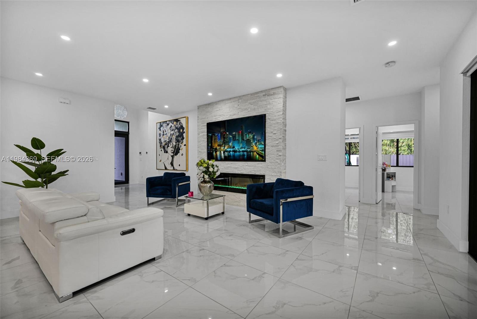 13334 Southwest 227th Street Miami, FL 33170 - Photo 36 of 69 a living room with furniture and a flat screen tv