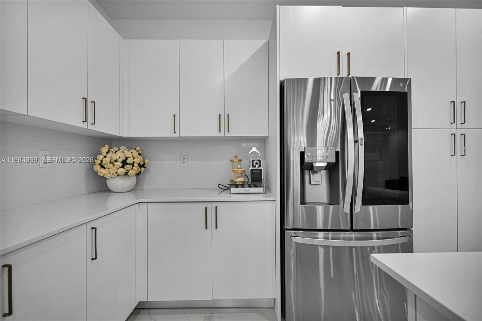 13334 Southwest 227th Street Miami, FL 33170 - Photo 43 of 69 a kitchen with stainless steel appliances granite countertop a refrigerator and a stove
