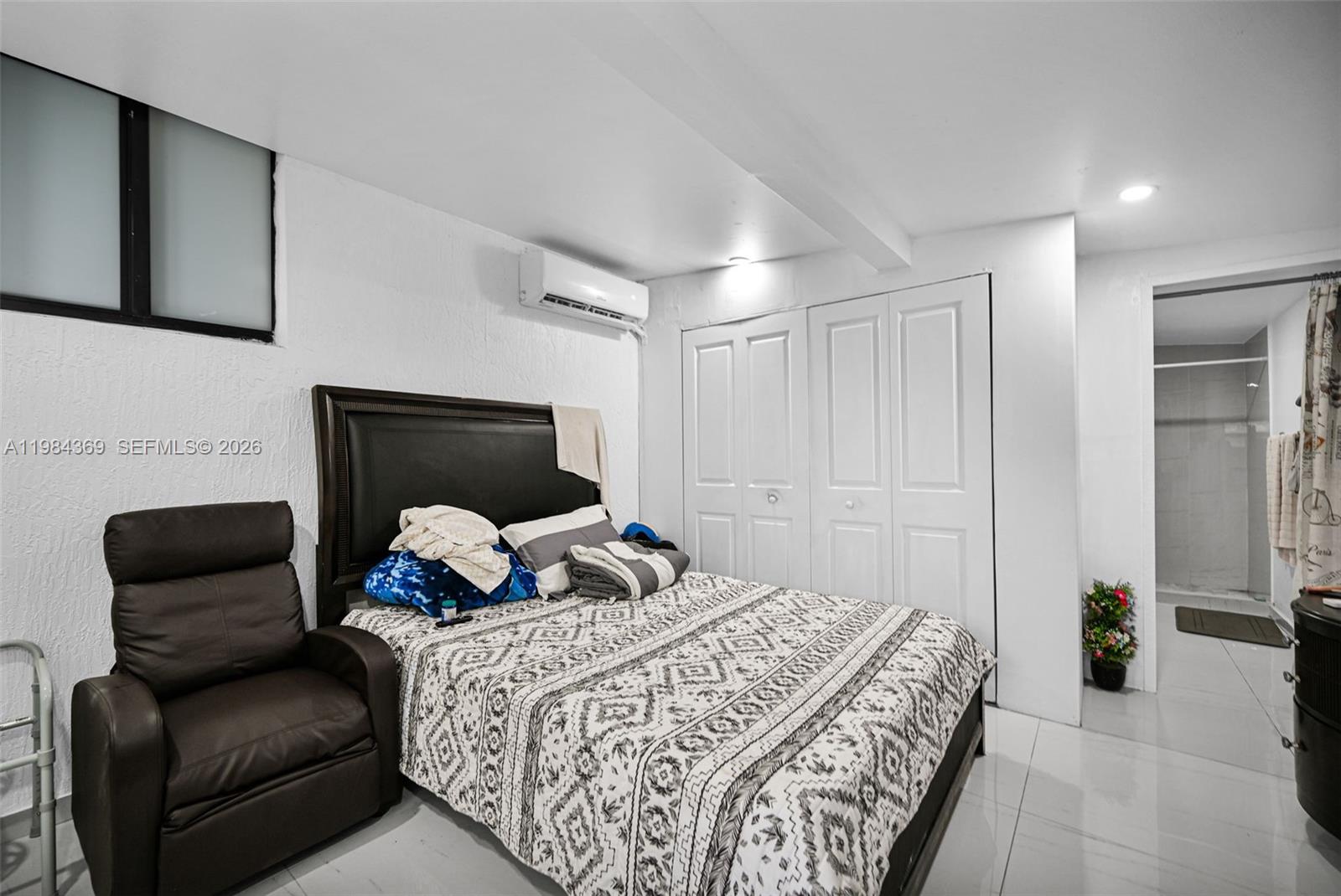 13334 Southwest 227th Street Miami, FL 33170 - Photo 45 of 69 a bedroom with a bed and chair