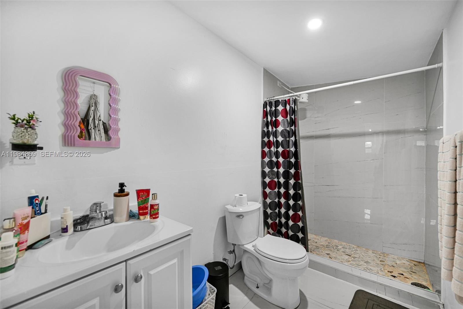 13334 Southwest 227th Street Miami, FL 33170 - Photo 48 of 69 a bathroom with a sink a toilet and shower