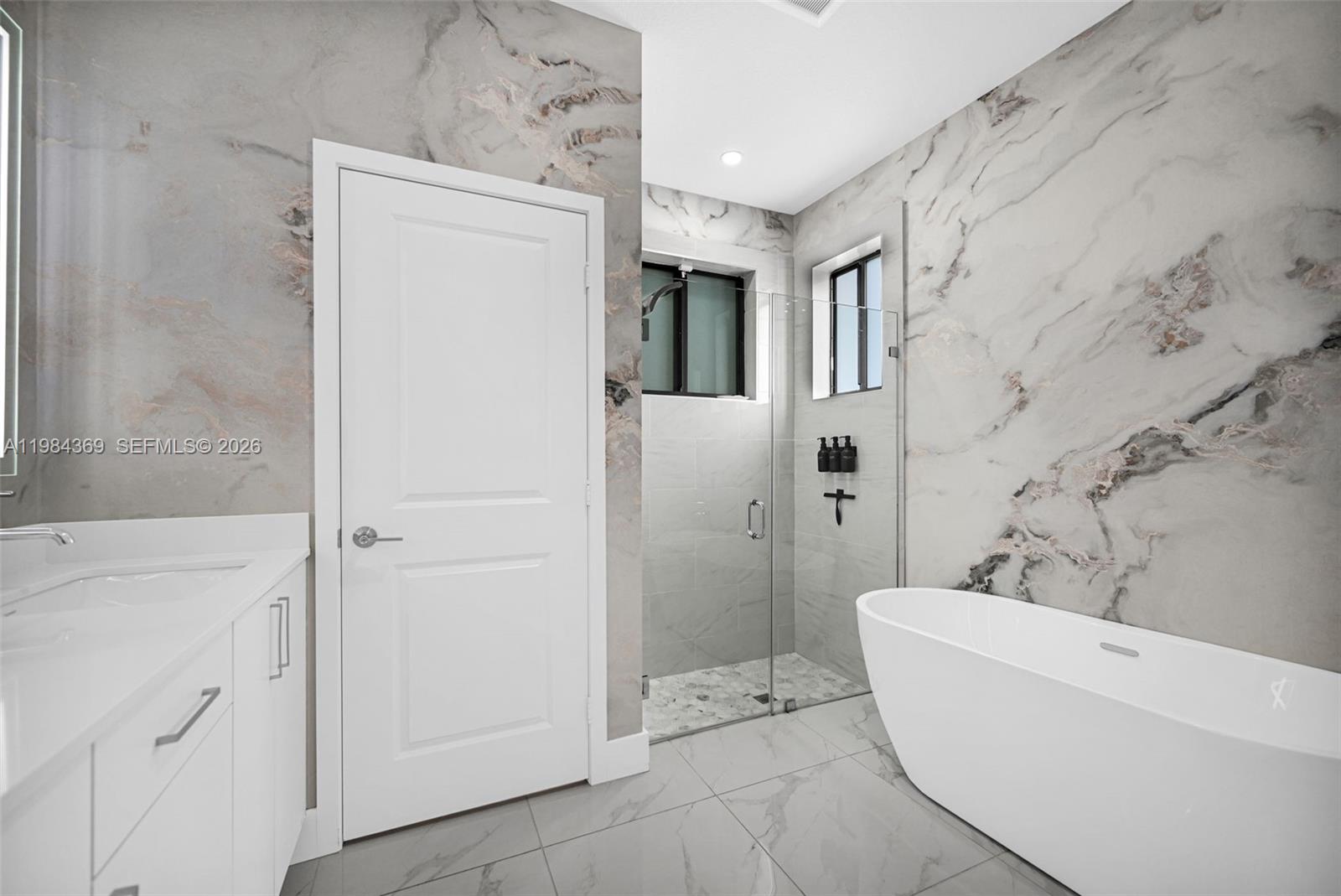 13334 Southwest 227th Street Miami, FL 33170 - Photo 54 of 69 a bathroom with a bathtub and a sink