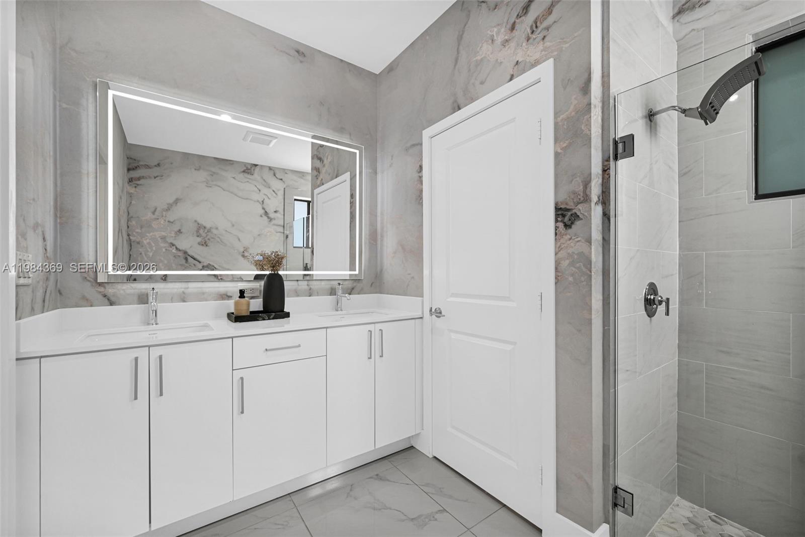 13334 Southwest 227th Street Miami, FL 33170 - Photo 55 of 69 a bathroom with a sink and a mirror