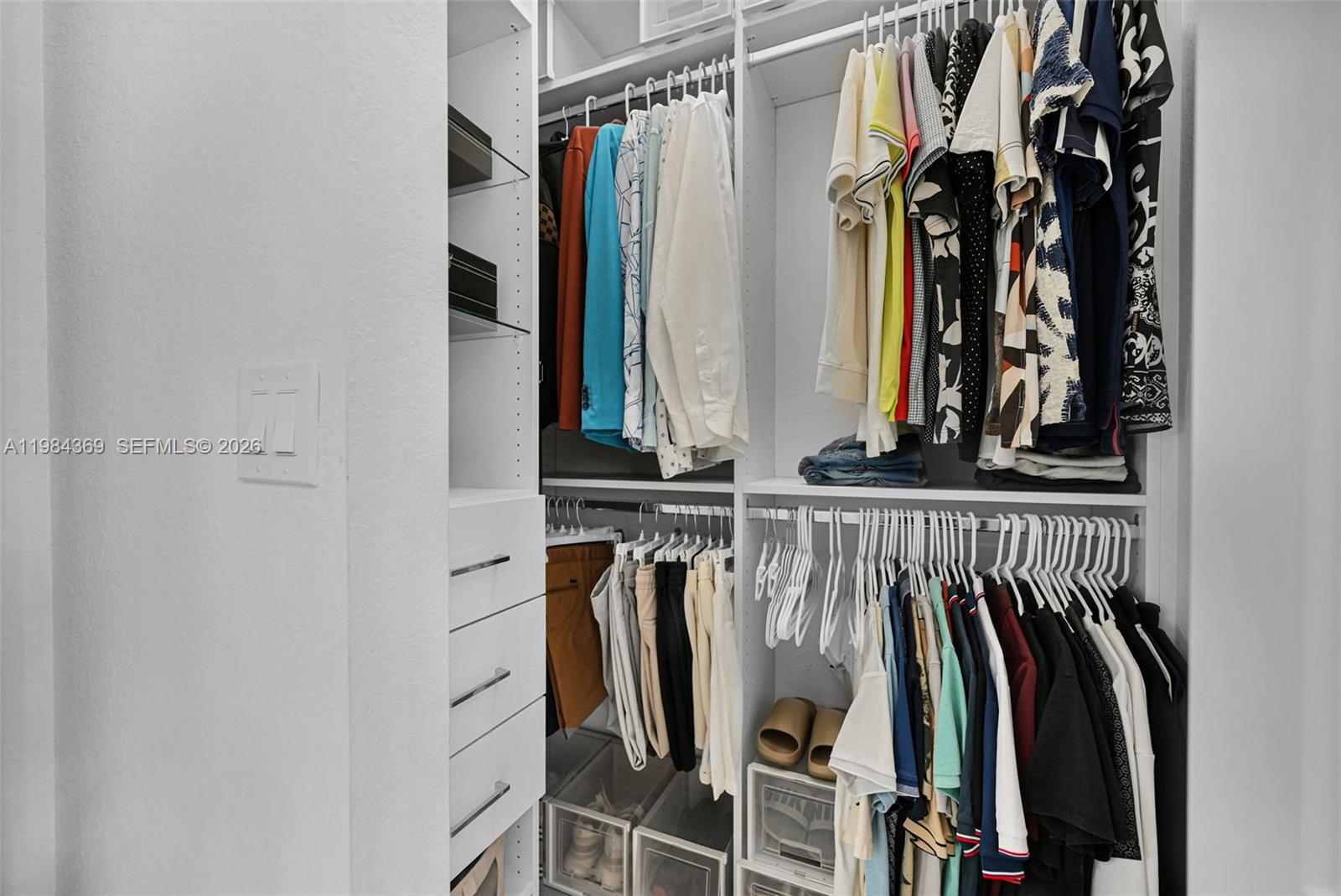 13334 Southwest 227th Street Miami, FL 33170 - Photo 58 of 69 a view of walk in closet with clothes