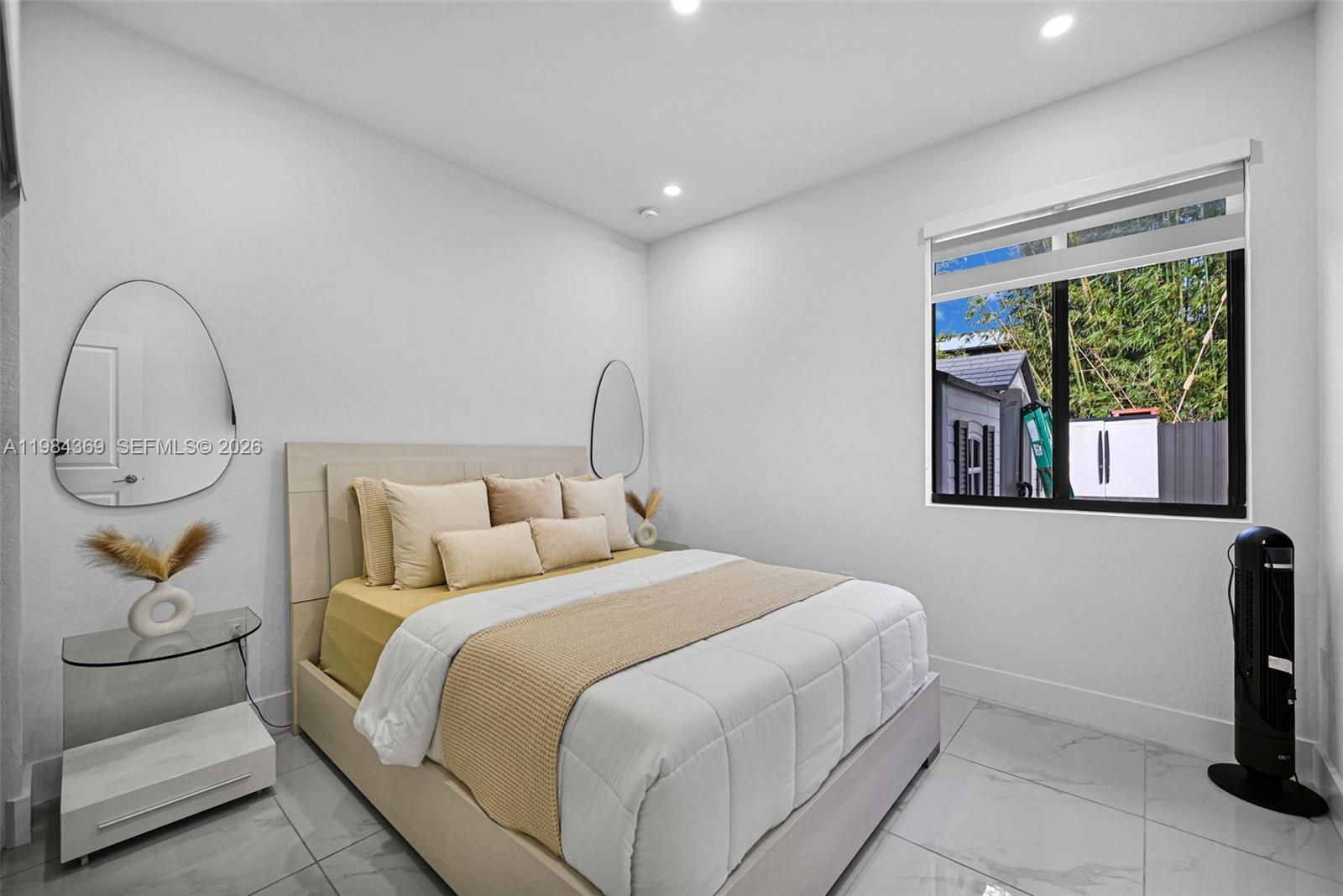 13334 Southwest 227th Street Miami, FL 33170 - Photo 61 of 69 a bedroom with a bed and a window