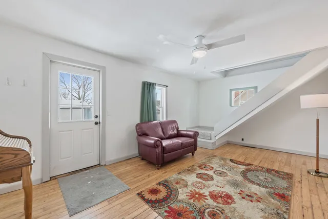 a living room with furniture and a rug
