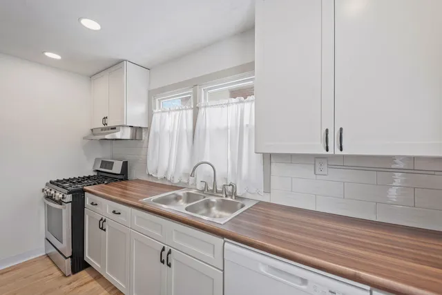 a kitchen with a sink and cabinets