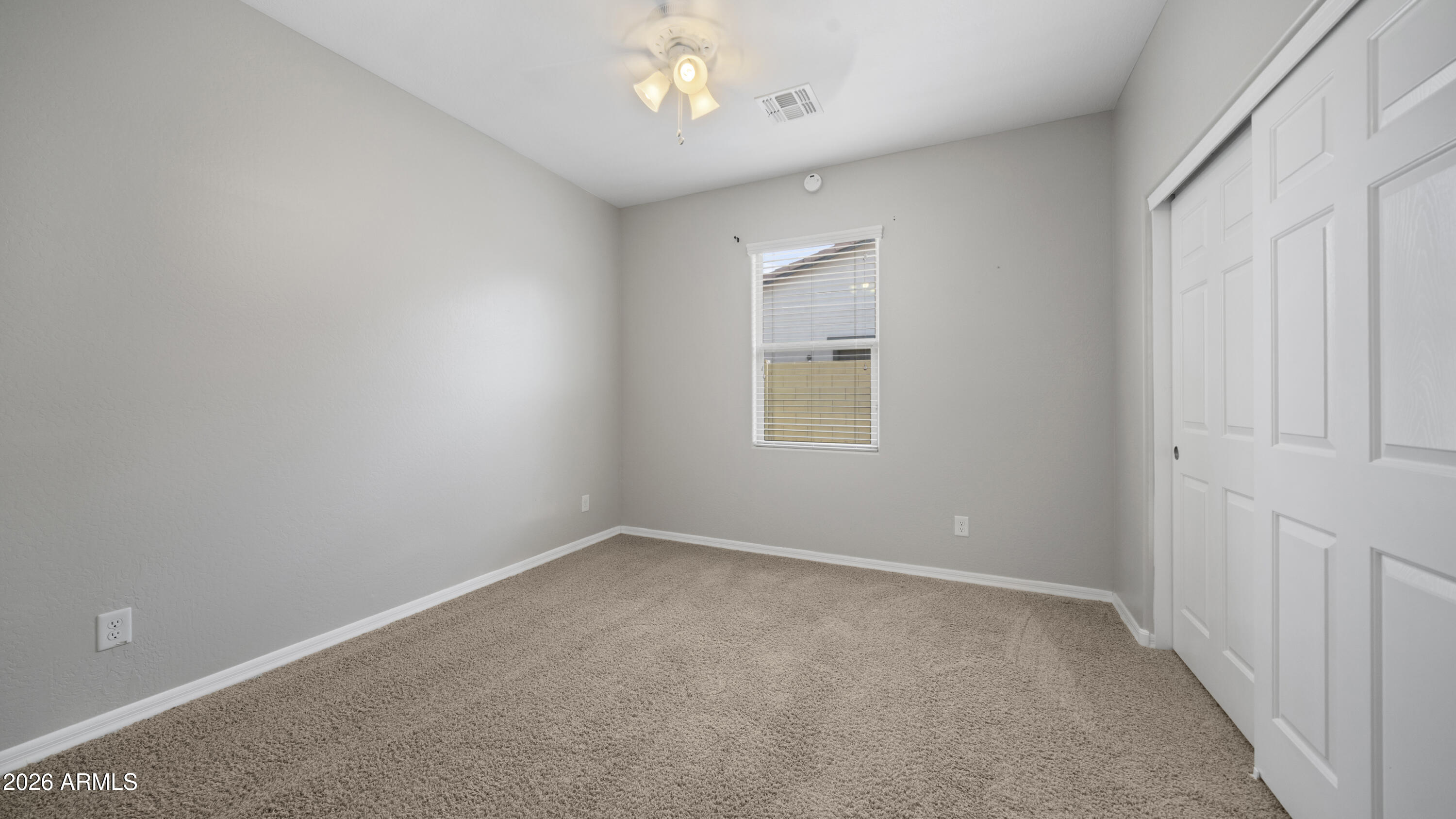16159 West Granada Road Goodyear, AZ 85395 - Photo 32 of 41 an empty room with a window