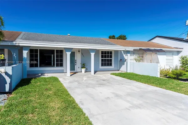 a view of a house with a garden