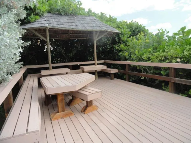 a view of sitting area with furniture and wooden deck