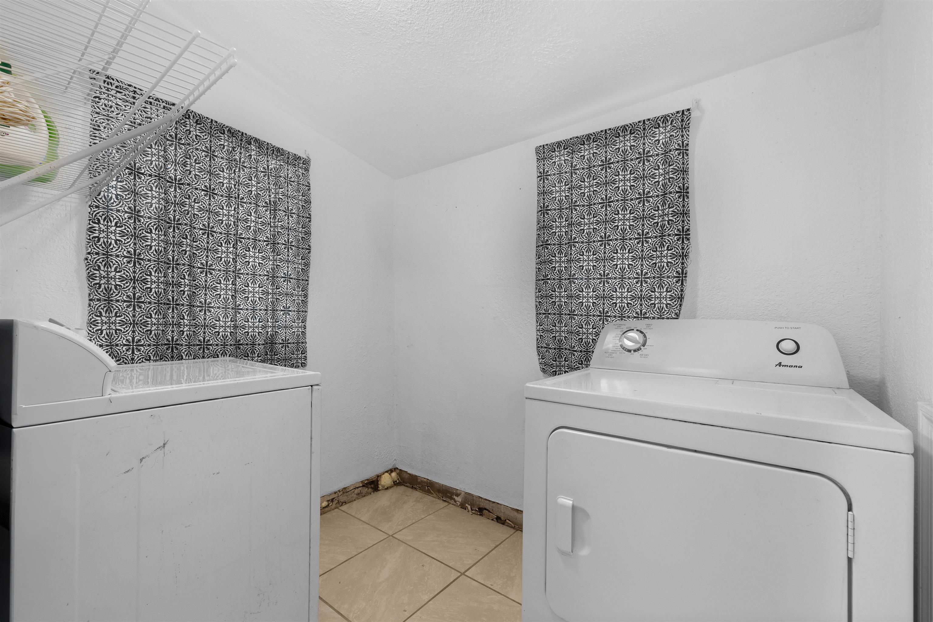 1463 Spring Street St. Augustine, FL 32084 - Photo 13 of 27 a utility room with dryer and washer