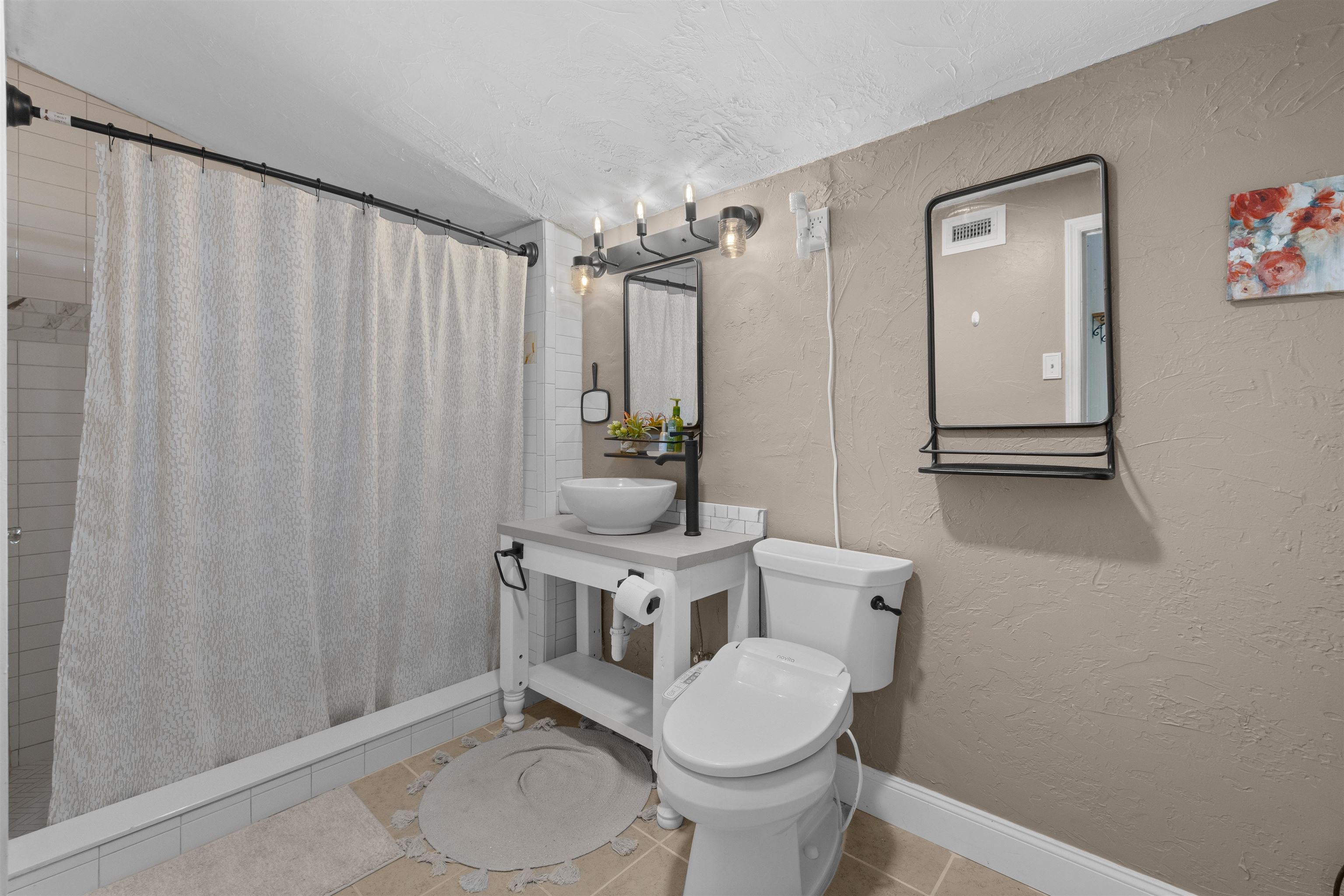 1463 Spring Street St. Augustine, FL 32084 - Photo 20 of 27 a white toilet sitting next to a bathroom sink