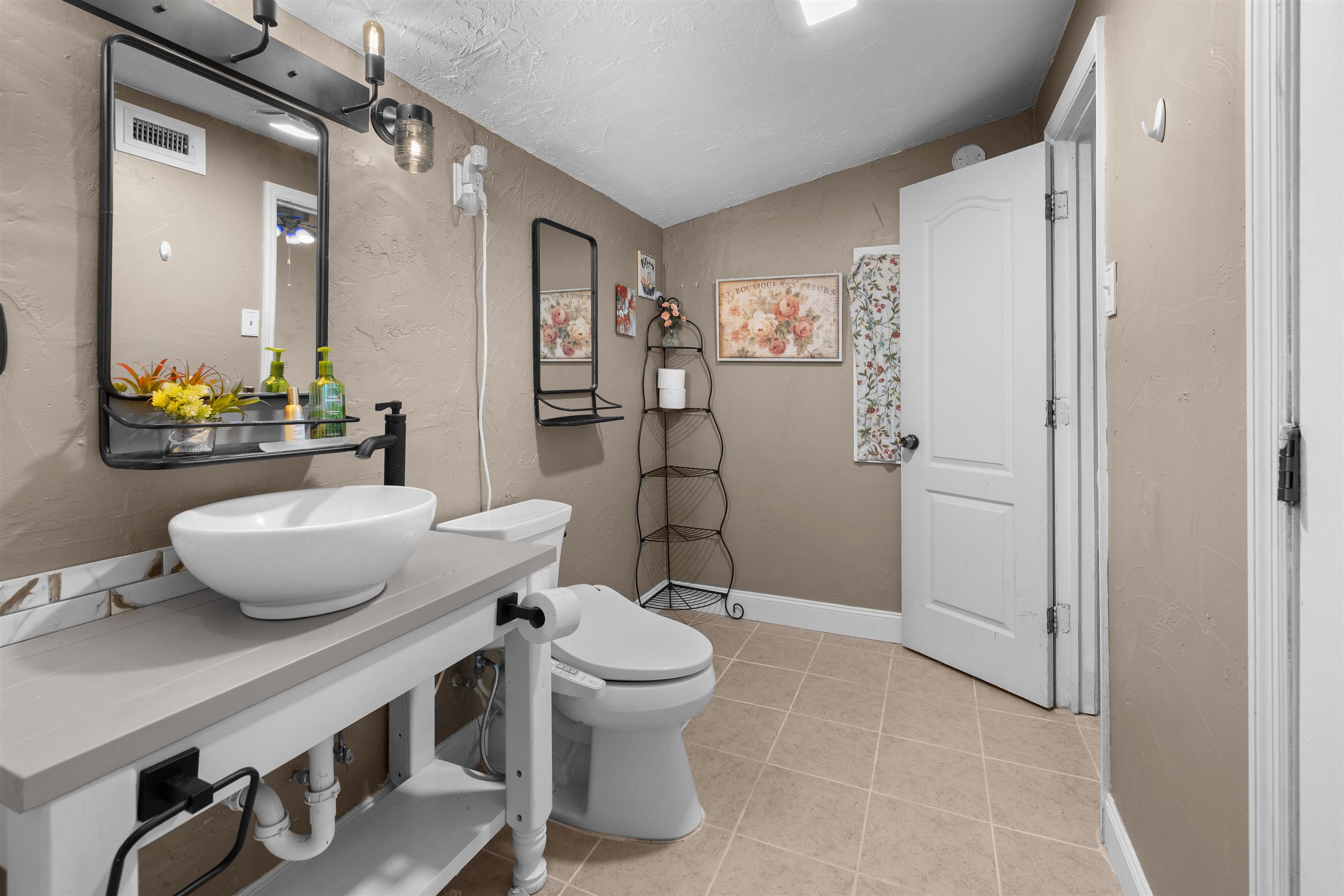 1463 Spring Street St. Augustine, FL 32084 - Photo 21 of 27 a bathroom with a sink toilet and shower