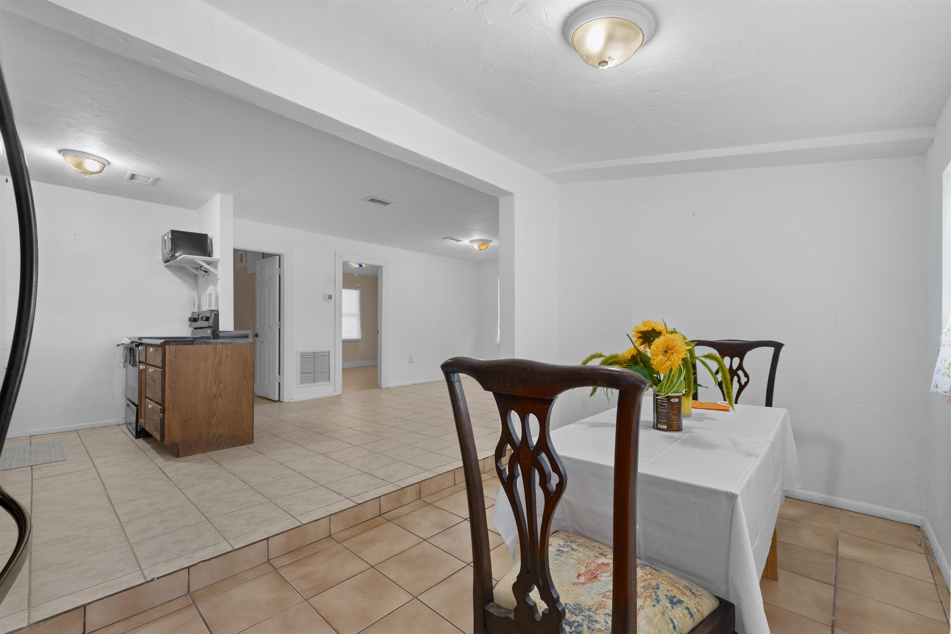 1463 Spring Street St. Augustine, FL 32084 - Photo 6 of 27 a view of kitchen with furniture and refrigerator