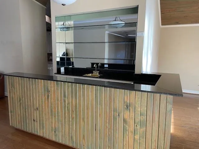 a view of an empty room with a window and a ceiling fan