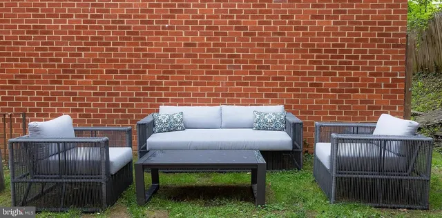 a view of backyard with seating space