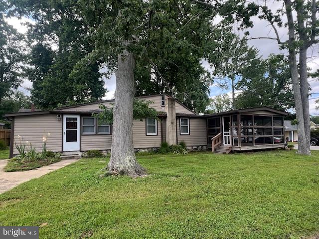 a view of a house with yard and a tree