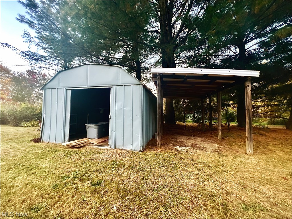 3122 Bedrock Road Northwest Dellroy, OH 44620 - Photo 8 of 23 View of outdoor structure featuring a carport